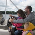 Joe and his kids driving the boat